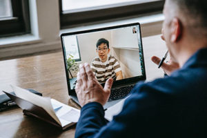 mentor and mentee connect virtually over video call