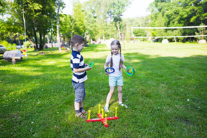 young kids playing in their yard