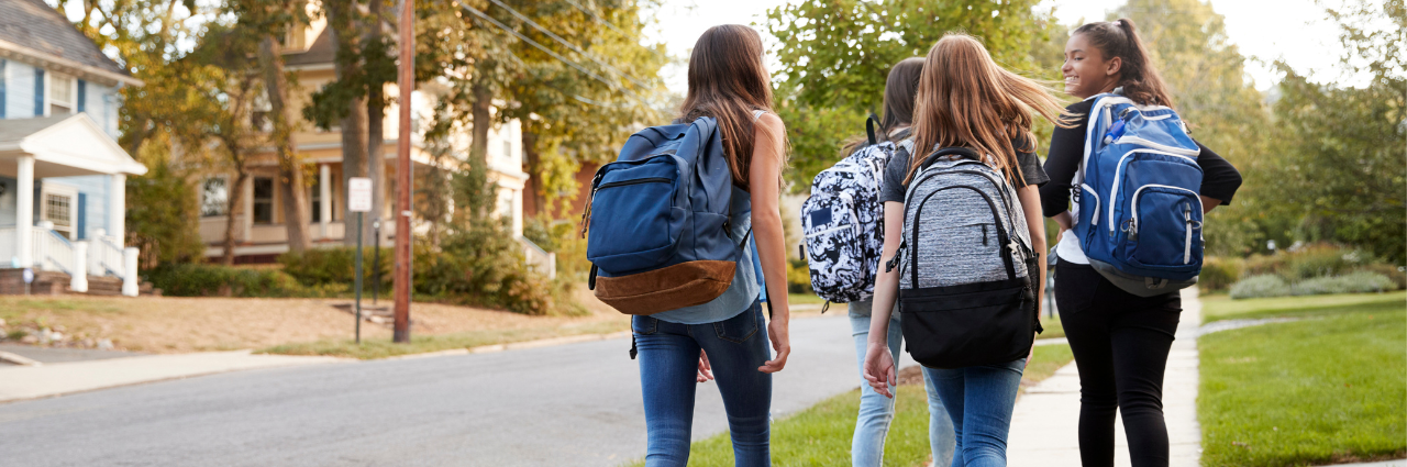 teens backs walking to school